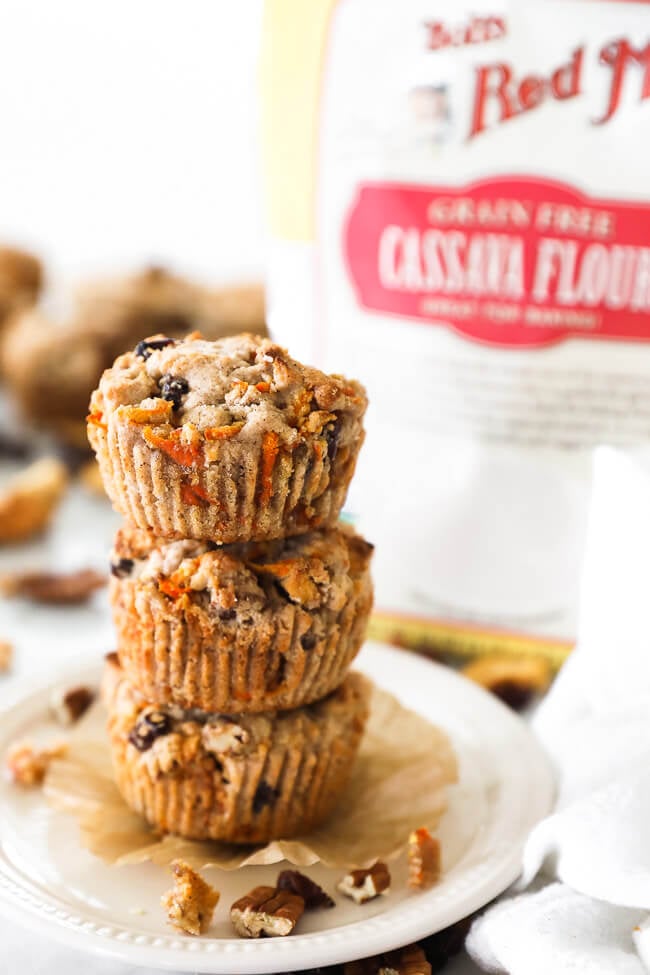 Vertical straight on image of a stack of three breakfast muffins. 