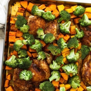 Overhead shot of sheet pan with chicken, squash and broccoli