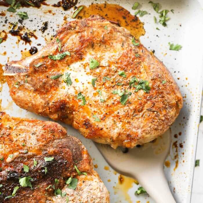 Overhead image of cooked oven baked bone in pork chops