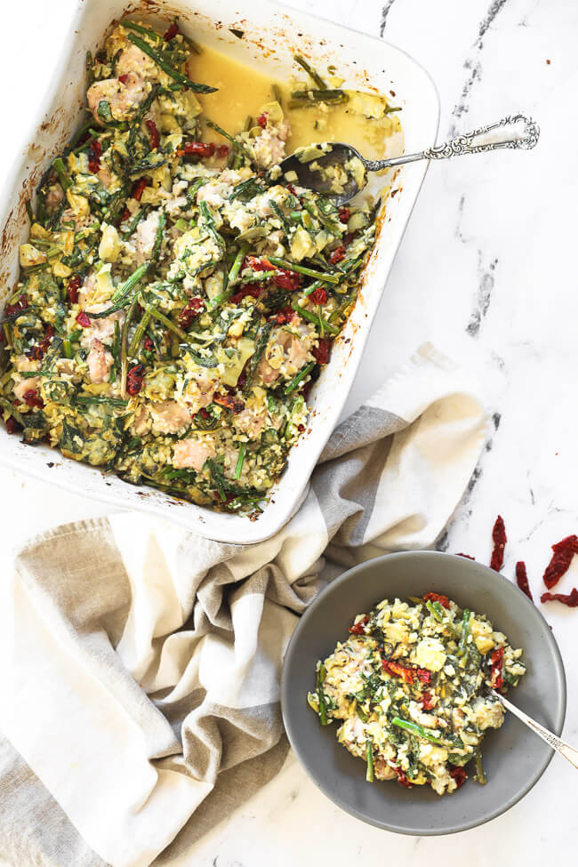 Overhead image of casserole in dish with some taken out and served in a bowl. 