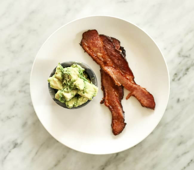 Bacon and guacamole on a plate
