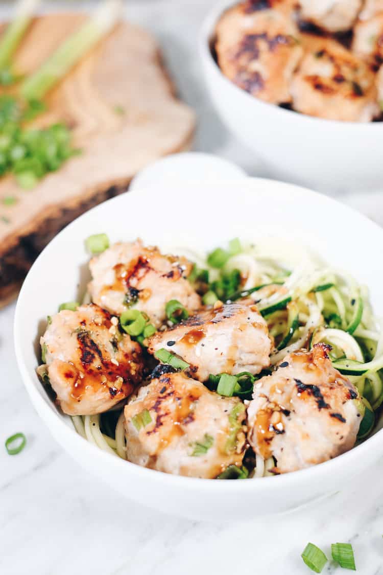 Bowls and meatballs are pretty much always a good idea, so we created this Paleo Asian meatballs noodle bowl recipe. You will love this simple and clean combo for an easy dinner or meal prep lunches. #paleo #glutenfree #soyfree #mealprep | realsimplegood.com