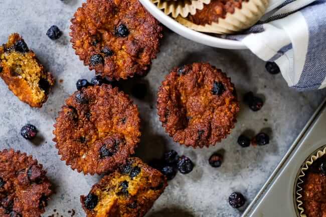 Paleo blueberry muffins spread out on the table. 