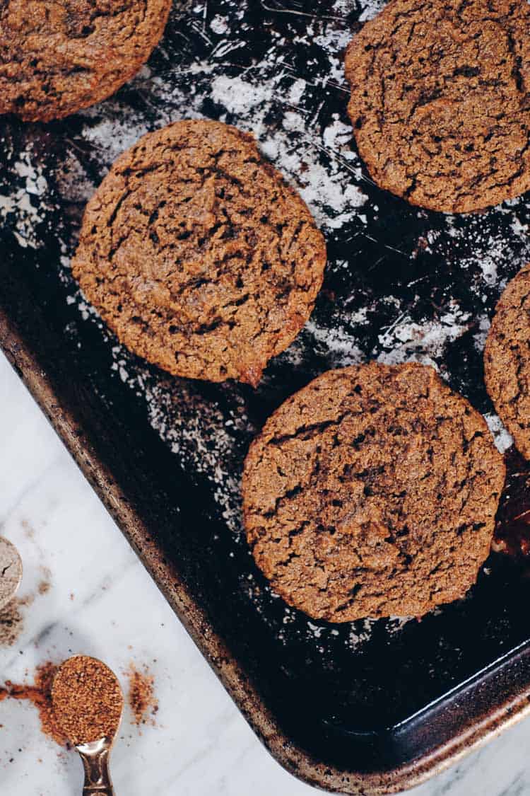 Chai spiced cookies spread out on a sheet pan