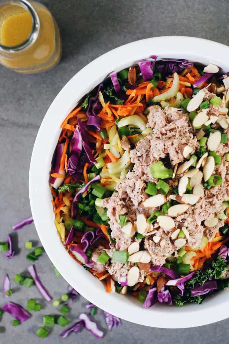 One of my favorite salads to make ahead of time and enjoy the leftovers for lunch is this Whole30 and Paleo Chinese chicken salad. It's packed with colorful veggies (cabbage, carrots, kale, onions and celery) plus easy shredded chicken and a simple dressing. Paleo + Whole30 | realsimplegood.com