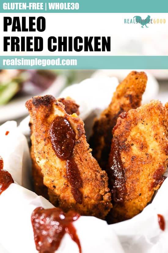 Paleo fried chicken like fries in a mug with parchment paper and drizzled BBQ sauce. 