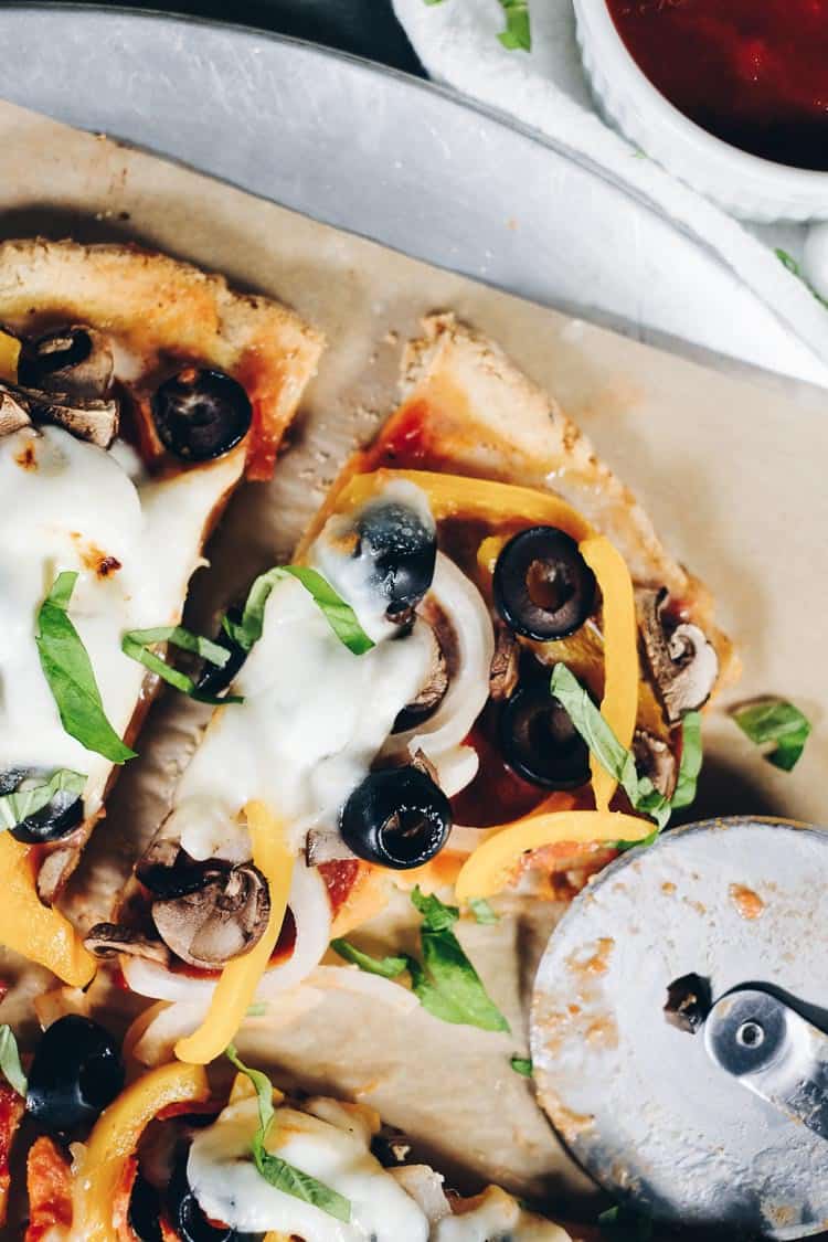 This Paleo pizza recipe is delicious and also uncomplicated and easily customized. The crust is buttery and a little flaky, yet strong enough to pick up! Paleo, Grain-Free and Dairy-Optional | realsimplegood.com