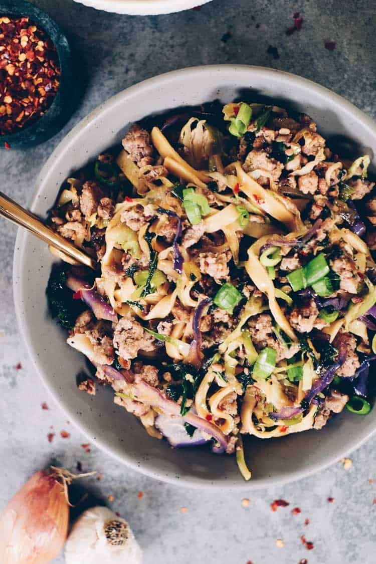 These Paleo potsticker noodle bowls are the BEST! Filled with cruciferous veggies, grain-free pasta and deliciously seasoned ground pork! Paleo, Gluten-Free, Dairy-Free + Soy-Free. | realsimplegood.com