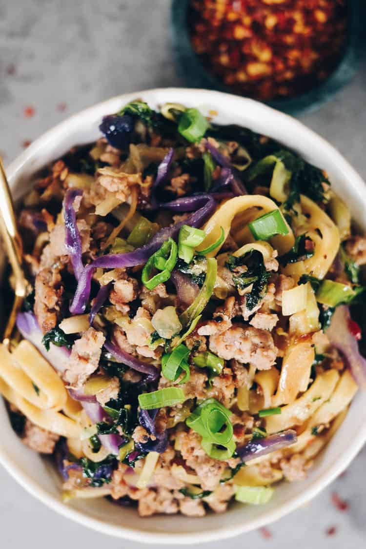 These Paleo potsticker noodle bowls are the BEST! Filled with cruciferous veggies, grain-free pasta and deliciously seasoned ground pork! Paleo, Gluten-Free, Dairy-Free + Soy-Free. | realsimplegood.com
