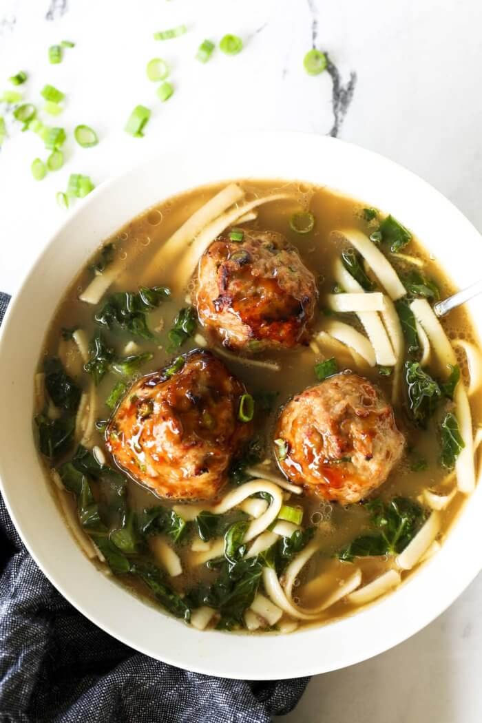 Overhead image of teriyaki meatballs served in a bowl of ramen.