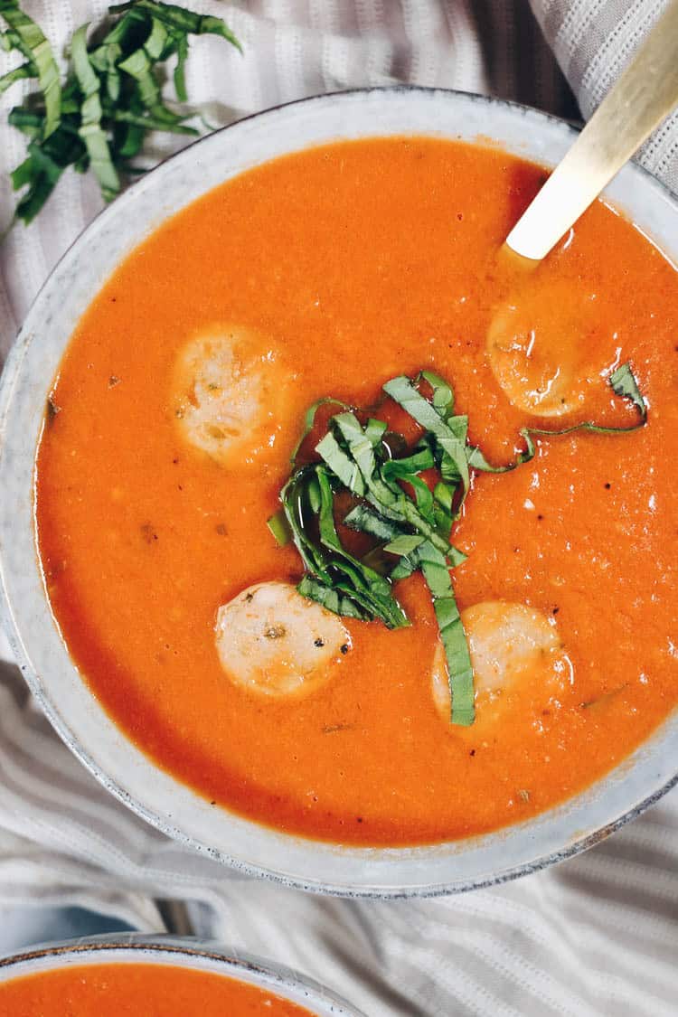 This Whole30 Paleo tomato basil soup with sausage is a bit of a spicier twist on traditional tomato soup with added protein and is quick and easy to make! #paleo #dairyfree #whole30 #recipe | realsimplegood.com