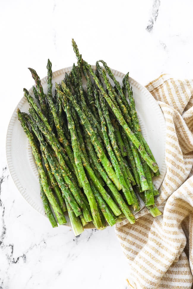 Air fryer asparagus served on a plate. 