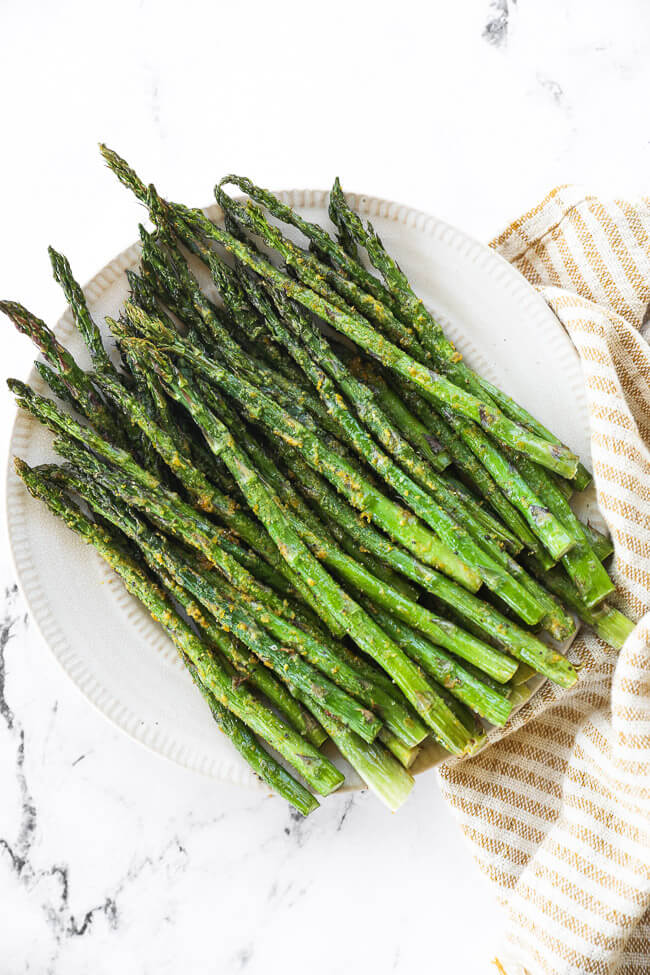 Air fryer asparagus served on a plate.