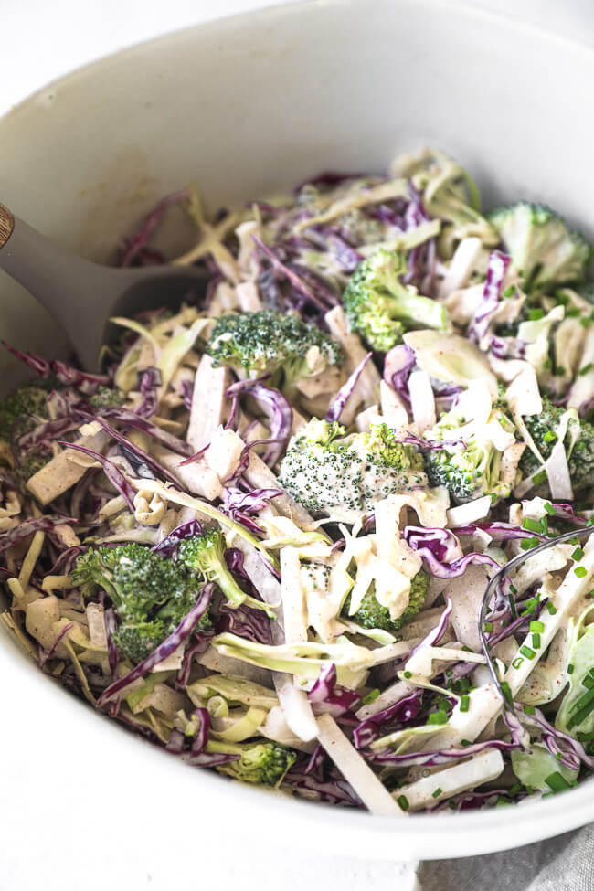 Close up angled image of the low carb coleslaw all mixed up in a serving bowl. 