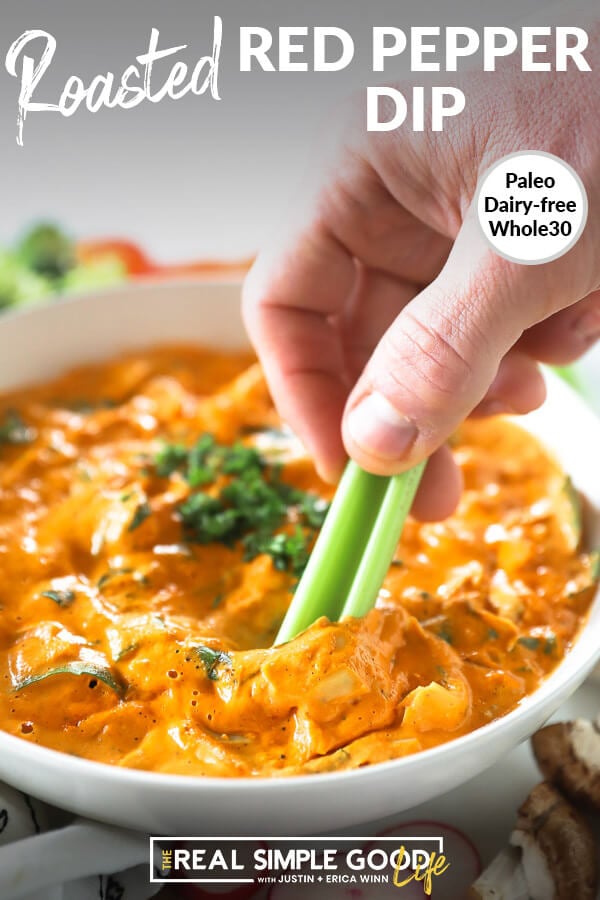 Close up image of dipping celery in roasted red pepper sauce with text overlay at top that says "Roasted Red Pepper Dip - Paleo, Dairy-Free, Whole30". 