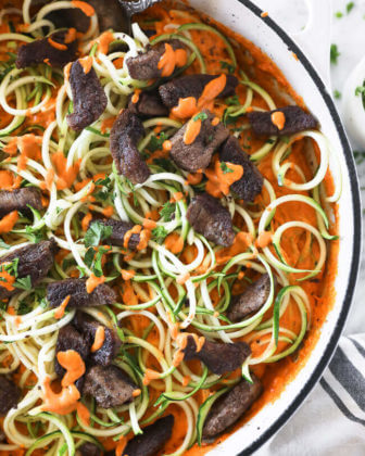Roasted red pepper pasta with zucchini noodles in a pan