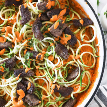Roasted red pepper pasta with zucchini noodles in a pan