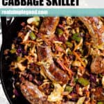 Sausage and cabbage skillet in a large cast iron skillet.