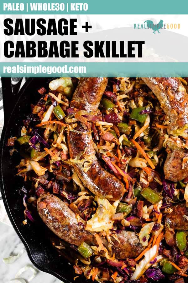 Sausage and cabbage skillet in a large cast iron skillet. 