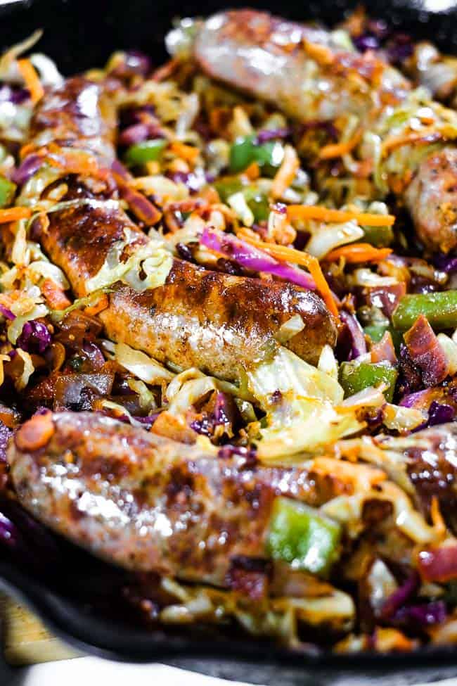 Close up angled shot of sausage and cabbage skillet. 