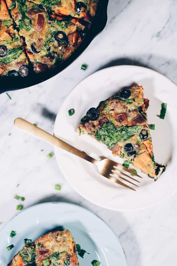 This Paleo + Whole30 sausage and sweet potato frittata is filling and full of the delicious flavors of sausage, sweet potatoes, olives and green onions. It will keep you going all morning! #paleo #whole30 #glutenfree #dairyfree #breakfast | realsimplegood.com