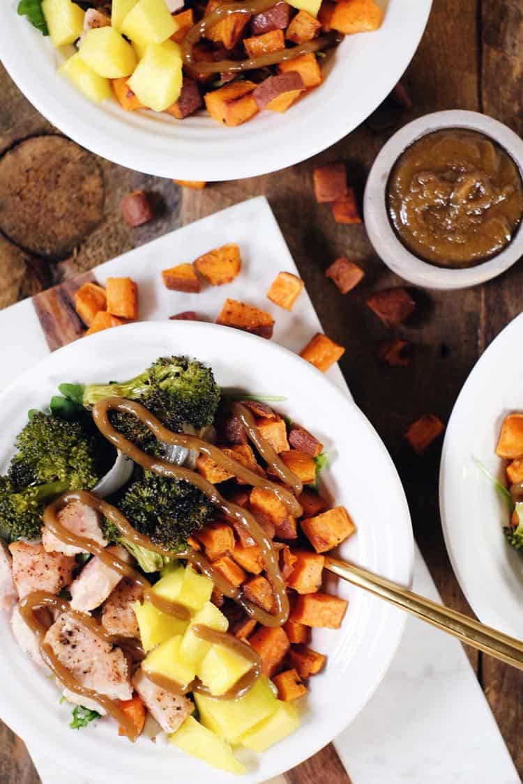 Go ahead and make these delicious sheet pan chicken buddha bowls! The perfect Paleo + Whole30 meal for making ahead of time for leftovers! Chicken, broccoli, sweet potato, mango, onion and tahini sauce. Paleo + Whole30. | realsimplegood.com