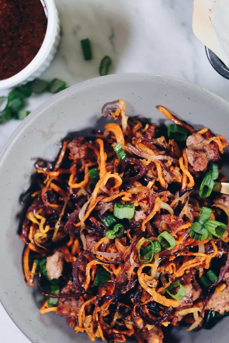 Enjoy the delicious flavors and textures of this Paleo and Whole30 Sheet Pan Crispy Vegetable Noodles and Pork recipe! You will crave the leftovers! | realsimplegood.com