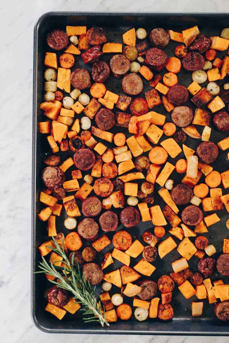 Whether you have an egg allergy or just want to mix things up, this Paleo and Whole30 Sheet Pan Roasted Sausage and Vegetables dish is for you! Squash, parsnips, carrots, sausage, greens and a creamy ranch. Paleo + Whole30 | realsimplegood.com