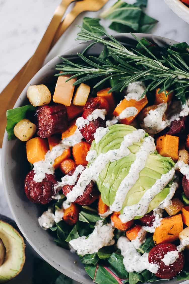 Whether you have an egg allergy or just want to mix things up, this Paleo and Whole30 Sheet Pan Roasted Sausage and Vegetables dish is for you! Squash, parsnips, carrots, sausage, greens and a creamy ranch. Paleo + Whole30 | realsimplegood.com