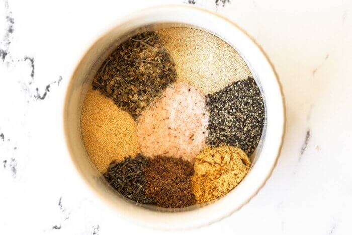 Close up overhead image of pot roast seasonings all separated out in a ramekin