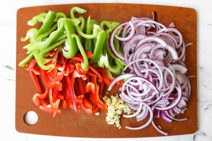Chopped green and red bell pepper, purple onion and garlic