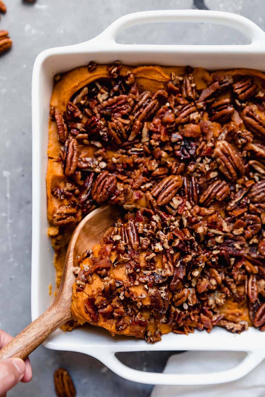 Overhead image of a sweet potato casserole with pecan topping