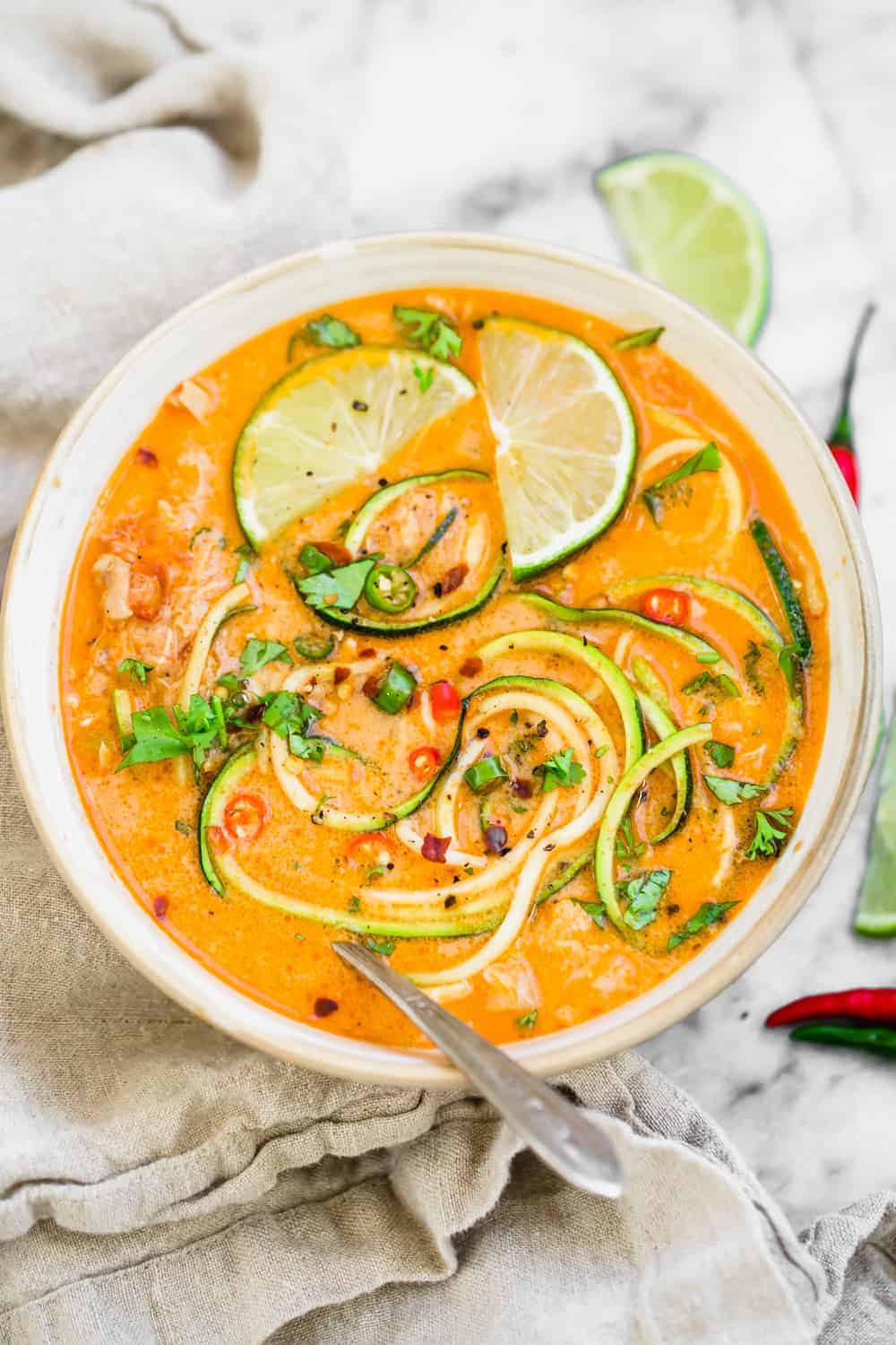 Thai chicken zoodle soup with orange sauce and lime