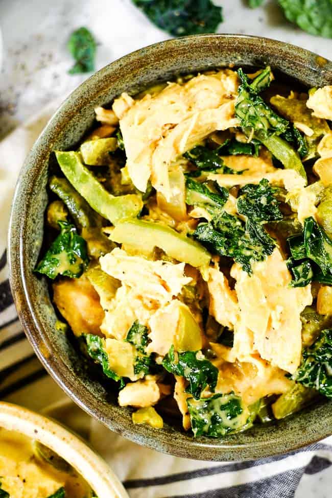 Close up shot of Thai coconut curry served in a bowl. 