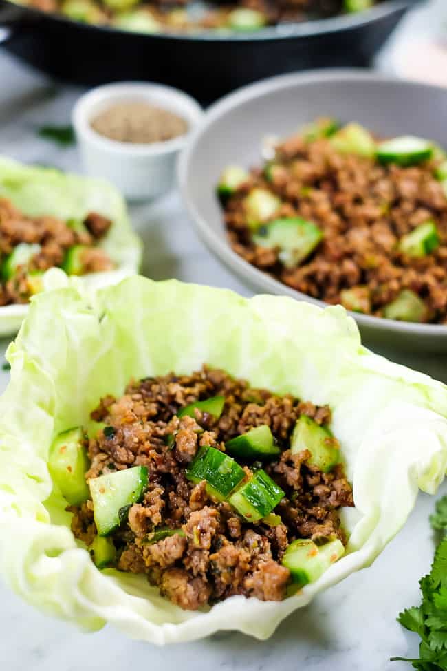This is a Thai larb recipe with ground pork or chicken, cucumber and some seasonings. Shown served in a cabbage shell. 