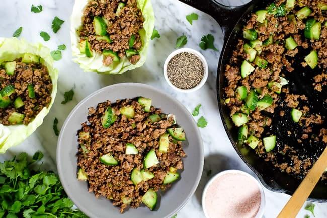 This is a Thai larb recipe with ground pork or chicken, cucumber and some seasonings. Served in a bowl and in cabbage shells. 
