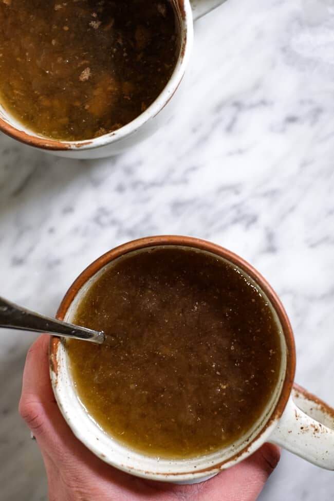 Mug of bone broth. A blog post about where to buy bone broth and why you should add it to your diet. 