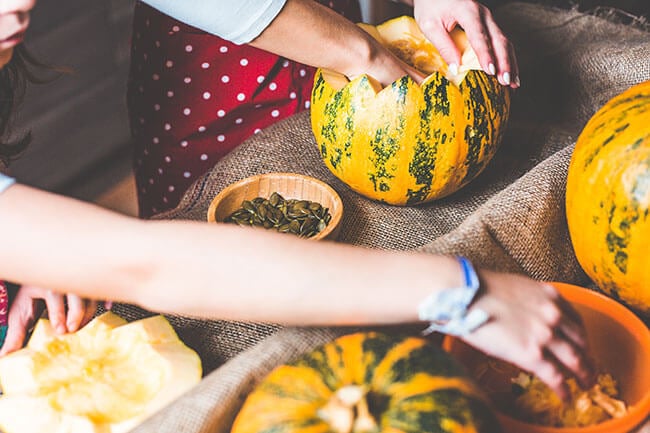 Family carving pumpkins