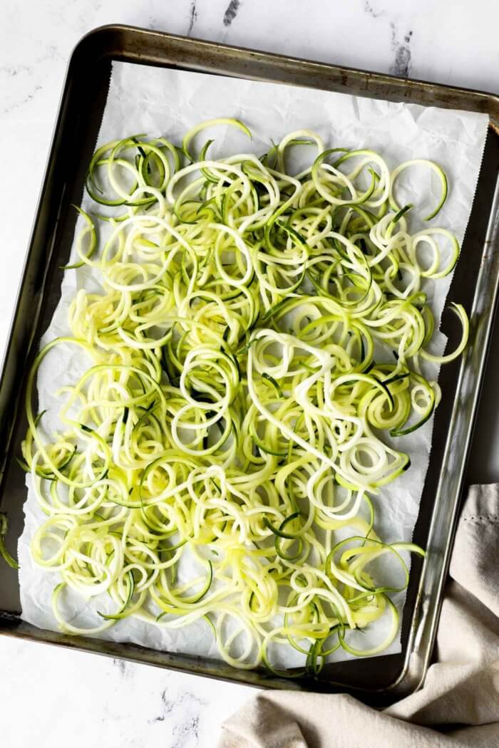 Overhead image of zoodles on a sheet pan. 