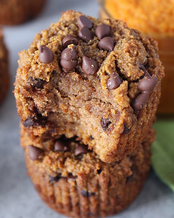 two stacked pumpkin muffins with chocolate chips