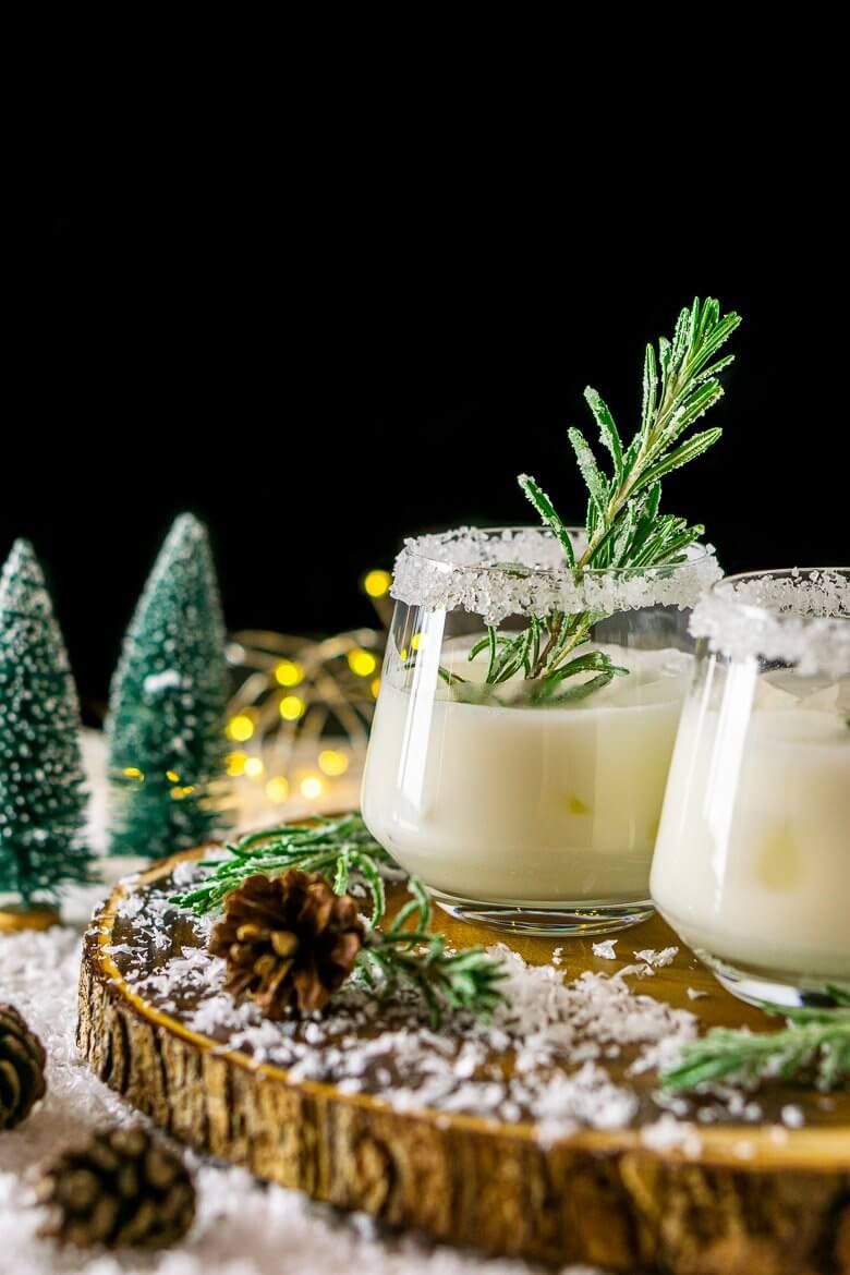 Christmas margaritas on a wooden circle with festive decorations